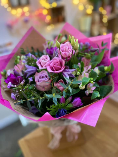 Lavender Delight - A beautiful handtied in water presented in a gift box, created using the fresh blooms of the day in pink and lilac with complementary foliage.