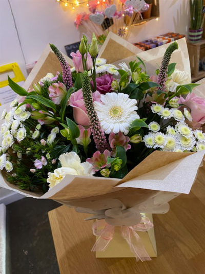 Floral Delight - An stunning handtied in water presented in a gift box, created using the fresh blooms of the day in pale pink and white with complementary foliage.
